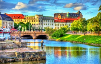 Scenic summer view of Nyhavn pier with color buildings, ships, yachts and other boats in the Old Town of Copenhagen, Denmark