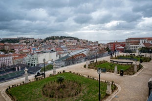 Photo of Lisbon City Skyline with Sao Jorge Castle and the Tagus River, Portugal.