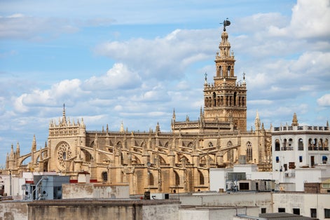 Photo of aerial view of Cathedral of Seville (Spanish: Catedral de Santa Maria de la Sede) Gothic architecture in Seville, Andalusia, Spain.