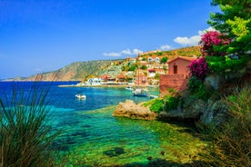 Photo of white boat in crystal clear blue sea water, Argostoli, Greece.