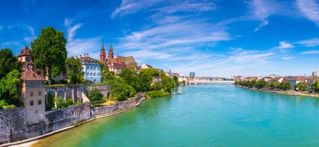 View of the Old Town of Basel with red stone Munster cathedral and the Rhine river, Switzerland.