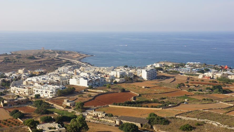 photo of view of Panoramic view of In-Naxxar coast wih Saint Mark's Tower from Top Of The World panoramic viewpoint. Gharghur. Malta.