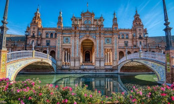 Photo of aerial view of Jaen with cathedral and Sierra Magina mountains on background, Andalusia, Spain.