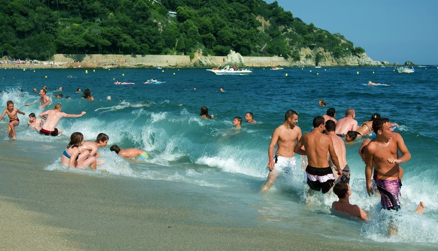 The vacationers basking on the coast of Spain in Lloret de Mar, Spain.