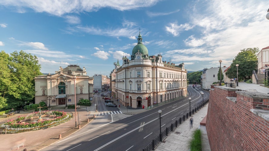 Panorama showing Theater Square with Main Post Office building aerial timelapse and Polish Theater, both built in 1890s, view from the Castle hill. Traffic on the street. Bielsko-Biala, Poland