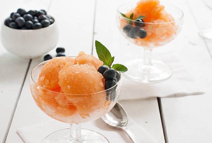 Cantaloupe granita in stemmed glasses, garnished with blueberries and mint..jpg