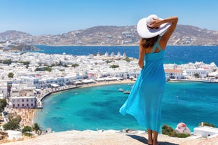 Photo of beautifull view over Mykonos from the sky with drone at the whitewashed village Greece.