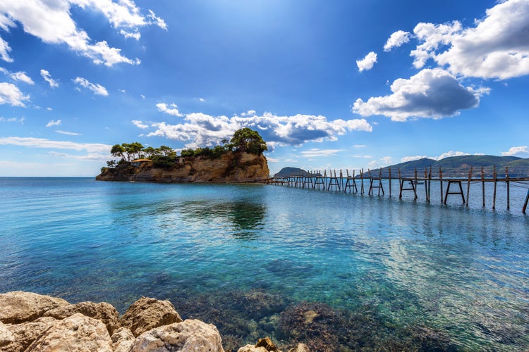 Photo of hanging footbridge on beautiful beach in Laganas to Cameo island, Zante, Greece