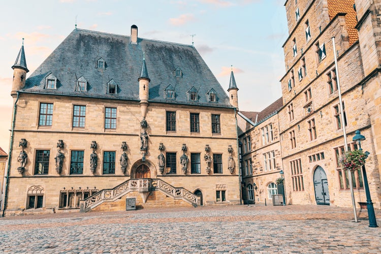 Photo of Beautiful Gothic city hall or Rathaus building in Osnabruck, Lower Saxony in Germany. Tourist and architectural attraction.