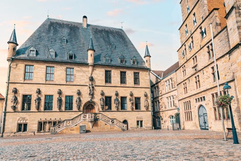 Photo of Beautiful Gothic city hall or Rathaus building in Osnabruck, Lower Saxony in Germany. Tourist and architectural attraction.