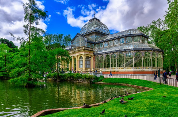 Photo of crystal Palace (Palacio de cristal) in Retiro Park in Madrid, Spain.