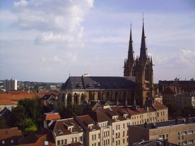 Photo of Metz city view of Petit Saulcy an Temple Neuf and Moselle River in Summer, France.