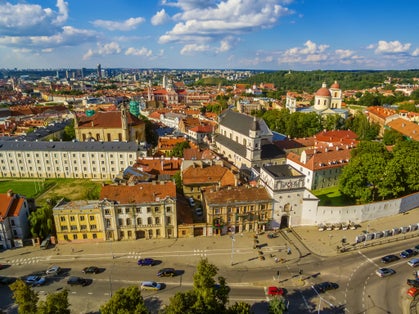 photo of aerial top view of old town in vilnius, Lithuania: the gate of dawn (Lithuanian: Ausros, Medininku vartai). The gate of dawn is one of the most important religious, historical and cultural monuments.