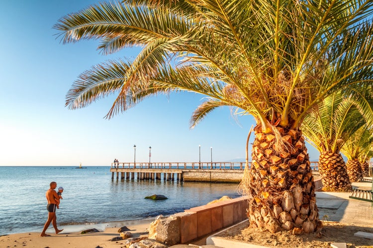 Sea view and sandy beach in The Paralia, a tourist seaside part of the municipality Katerini, Greece, Europe.