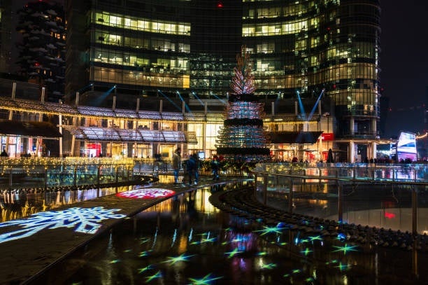 Downtown Milan during the Christmas season, with festive lights illuminating the streets and buildings.jpg