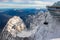 photo of cable car reaching the modern mountain station “Zugspitze“ (2962 m) on highest peak of Germany and part of the “Wetterstein“ alpine range near Garmisch-Partenkirchen in winter in Germany.