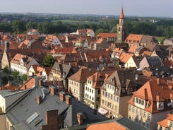 Photo of scenic summer view of the German traditional medieval half-timbered Old Town architecture and bridge over Pegnitz river in Nuremberg, Germany.