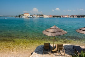 Photo of aerial view of town of Umag historic coastline architecture , archipelago of Istria region, Croatia.