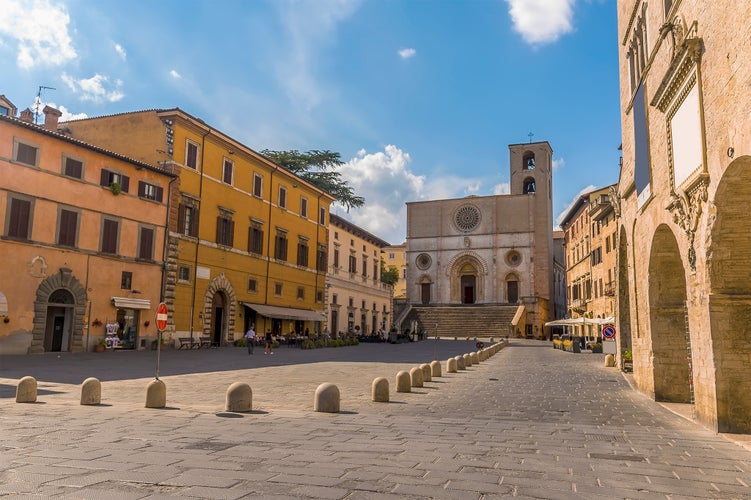 Photo of view across the main square towards the cathedral in the medieval city of Todi, Umbria, Italy.