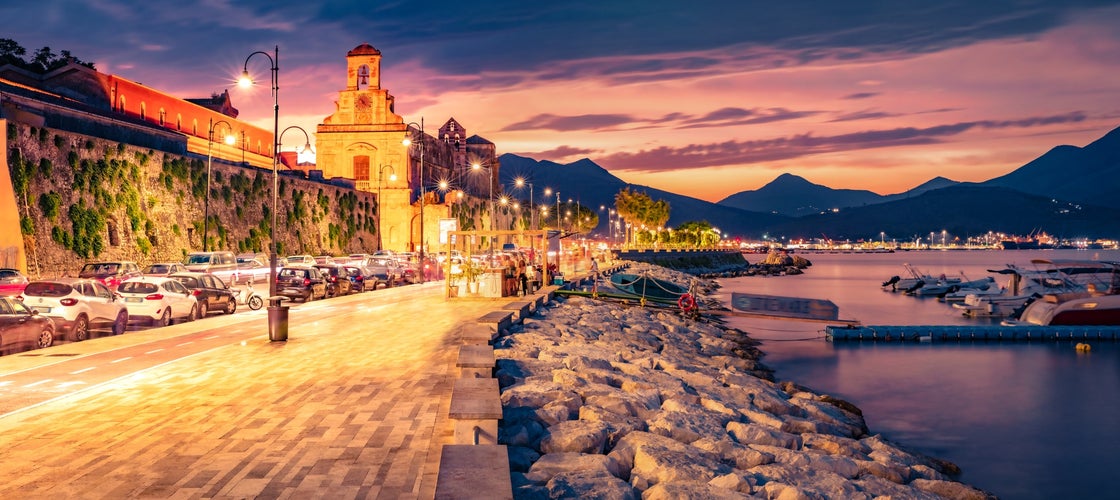 Cathedral Basilica of Gaeta church on background. Dramatic summer sunset on the coast of Mediterranean sea, Italy, Europe. 