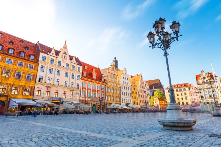 Fantastic view of the ancient homes on a sunny day. Gorgeous picture and picturesque scene. Location famous Market Square in Wroclaw, Poland, Europe. Historical capital of Silesia. Beauty world.