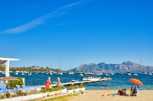 Photo of aerial view of the harbour of Port de Pollença, a seaside village located on the northern coast of Mallorca in the Balearic Islands, Spain.