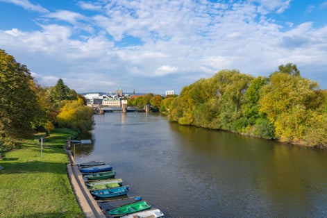 Photo of View over the river Fulda to downtown Kassel, Germany, on a sunny autumn day .