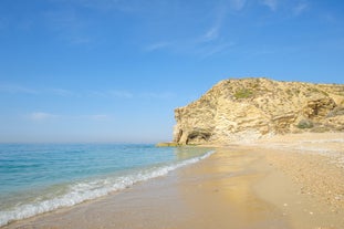 Photo of aerial panoramic view coastline and La Vila Joiosa Villajoyosa touristic resort townscape, sandy beach and Mediterranean seascape, Costa Blanca, Spain.