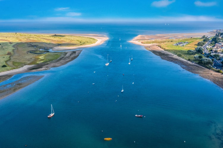 photo of aerial view of entrance to the harbor seaport in Malahide, Dublin county, Ireland. Seascape of the Irish coastline in summer.