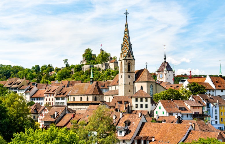 Photo of Church of the Assumption of Mary and a castle in Baden - Aargau, Switzerland.