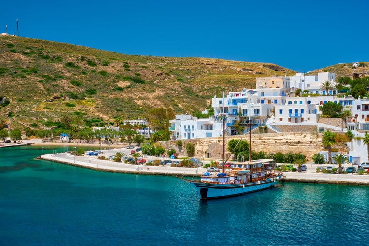 Photo of Adamantas Adamas harbor town of Milos island. Milos, Greece view from sea.