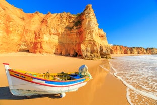 Photo of aerial view of touristic Portimao with wide sandy Rocha beach, Algarve, Portugal.