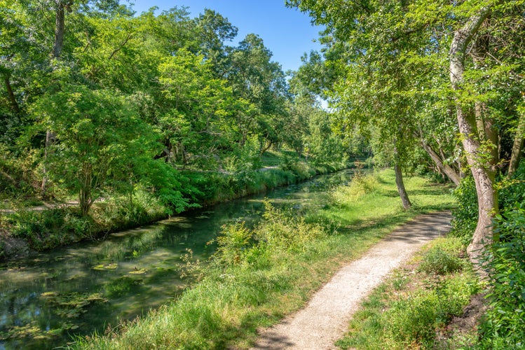 Photo of water canal in public park Charruyer, La Rochelle, France.