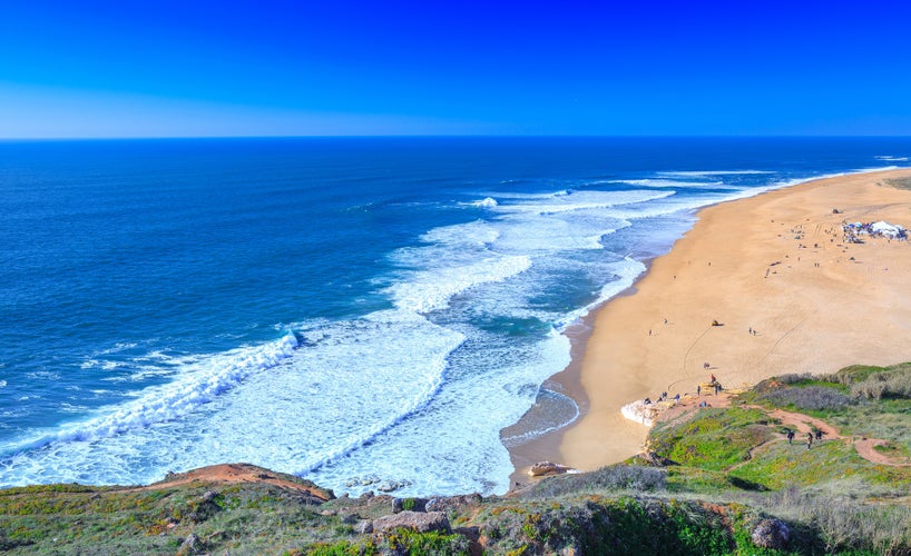 Photo of most famous place of giant breaking waves for surfers from around the world, Nazare, Portugal.