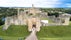 Photo of aerial view of Warkworth Castle, a ruined medieval building in the village of the same name, United Kingdom.