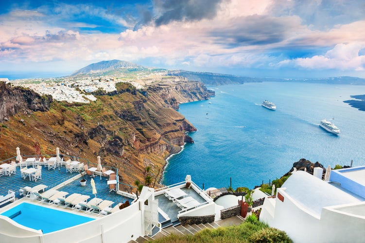 Photo of beautiful sea and caldera with typical white architecture of Santorini island, Greece.