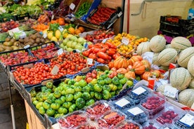 Local market visit and private cooking class at a Cesarina's home in Pavia