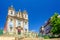 Photo of Saint Ildefonso Roman Catholic church in Batalha Square in Porto Oporto city historical centre, clear blue sky in sunny summer day background, Norte or Northern Portugal.