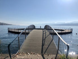 Panoramic view of historic Zurich city center with famous Fraumunster, Grossmunster and St. Peter and river Limmat at Lake Zurich on a sunny day with clouds in summer, Canton of Zurich, Switzerland