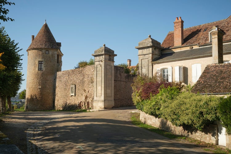 Town gate with protective wall and tower in Avallon, France