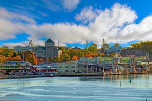 Early autumn morning panorama of the Port of Turku, Finland, with Turku Castle at background.