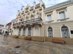 Photo of Water fountain in central square in Iasi town, Cultural Palace in background, Moldavia, Romania.