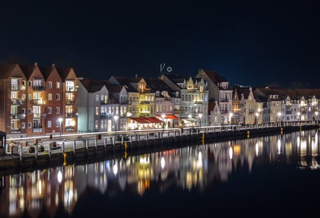 Night skyline city lights panorama of Sønderborg Havn (Sonderborg pier) before Christmas. Southern Denmark.