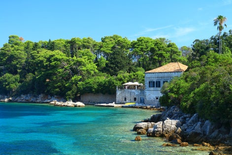 Photo of beautiful old house on Adriatic sea coast, Island Kolocep near Dubrovnik, famous touristic destination in Croatia.