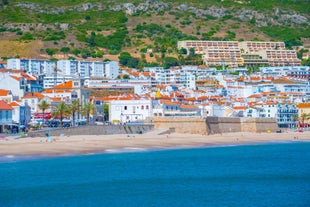 Photo of aerial view of Costa da Caparica coastline of glorious sandy beaches, powerful Atlantic waves, Portugal.