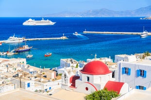 Photo of beautifull view over Mykonos from the sky with drone at the whitewashed village Greece.