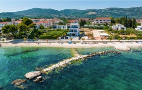 photo of a beautiful panoramic view of Kastel Luksic harbor and landmarks summer view, Split region of Dalmatia, Croatia.