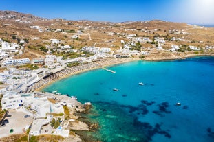 Photo of beautifull view over Mykonos from the sky with drone at the whitewashed village Greece.