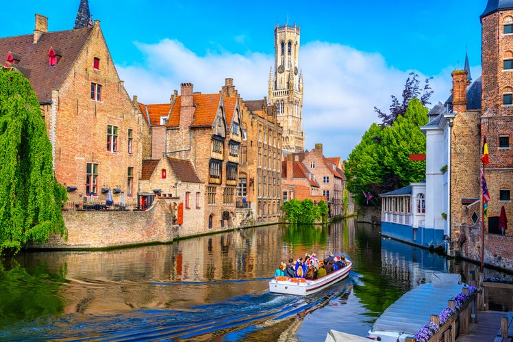 Classic view of the historic city center with canal in Brugge (Bruges), West Flanders province, Belgium. Cityscape of Bruges.