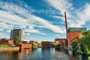 Early autumn morning panorama of the Port of Turku, Finland, with Turku Castle at background.